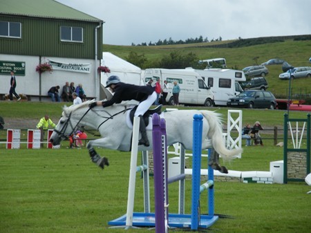 HORSE JUMPING AT THE WIGTOWN SHOW