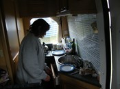 SHELBY COOKING IN THE KITCHEN AREA